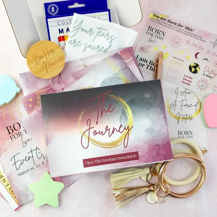 A Born for This box: affirmation cards, a printed journey envelope and a wooden token.